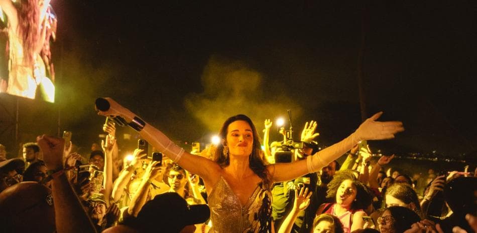 Monsieur Periné performs among the crowd at Isle of Light 2025