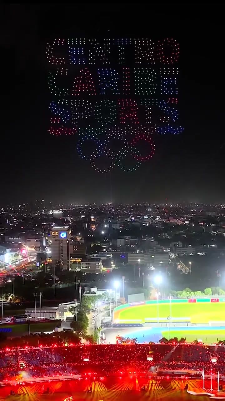 Drones create the Central American and Caribbean Games emblem above the stadium